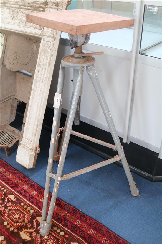 Two iron tripod based sculptures turntables H.107cm